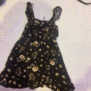 A floral dress that ties in the back, in size small.